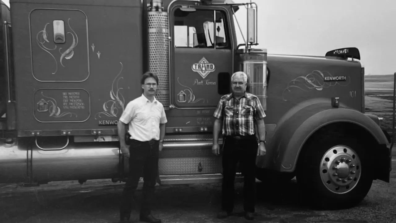 An early Trand Kenworth truck with two drivers