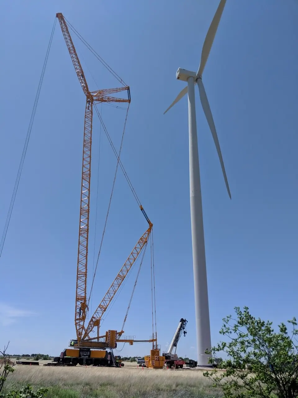 Trand lattice boom crane beside a wind turbine